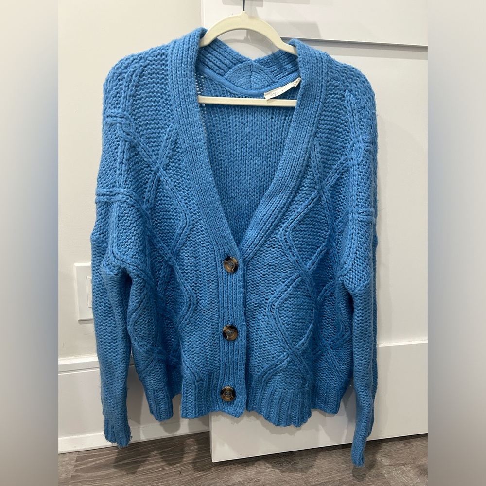 Chunky blue cardigan/sweater.